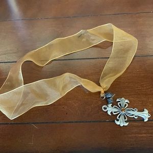 Cross pendant on ribbon necklace